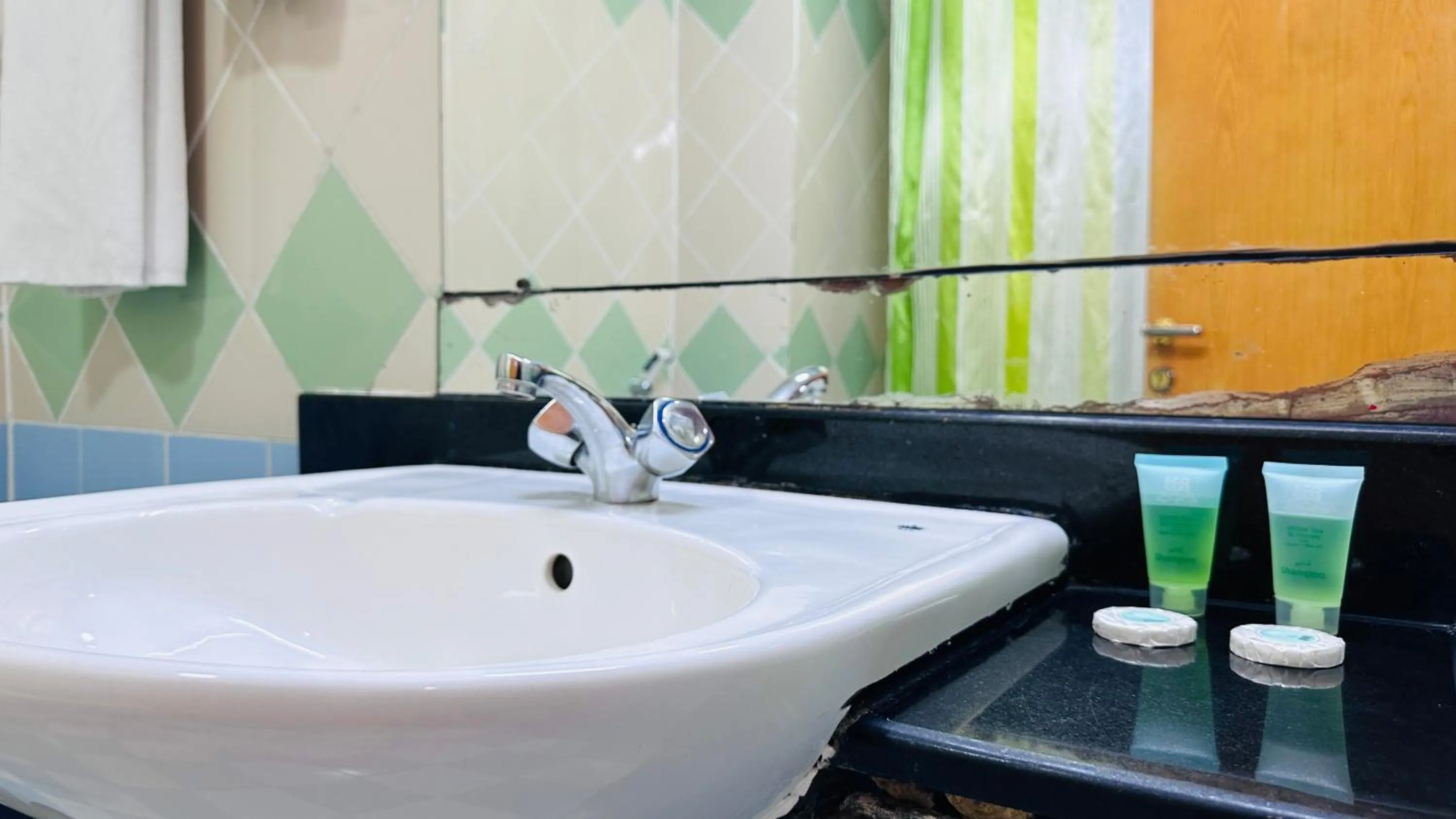 Bathroom in Collection O San Marino Hotel