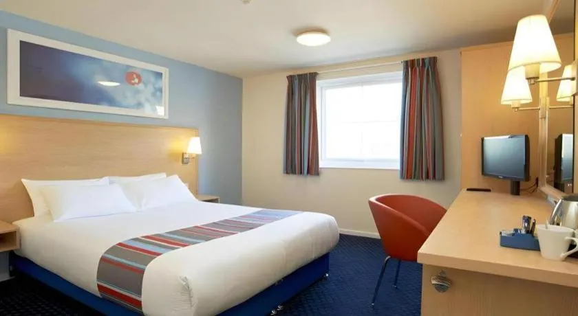 Bed in Travelodge Cambridge Swavesey