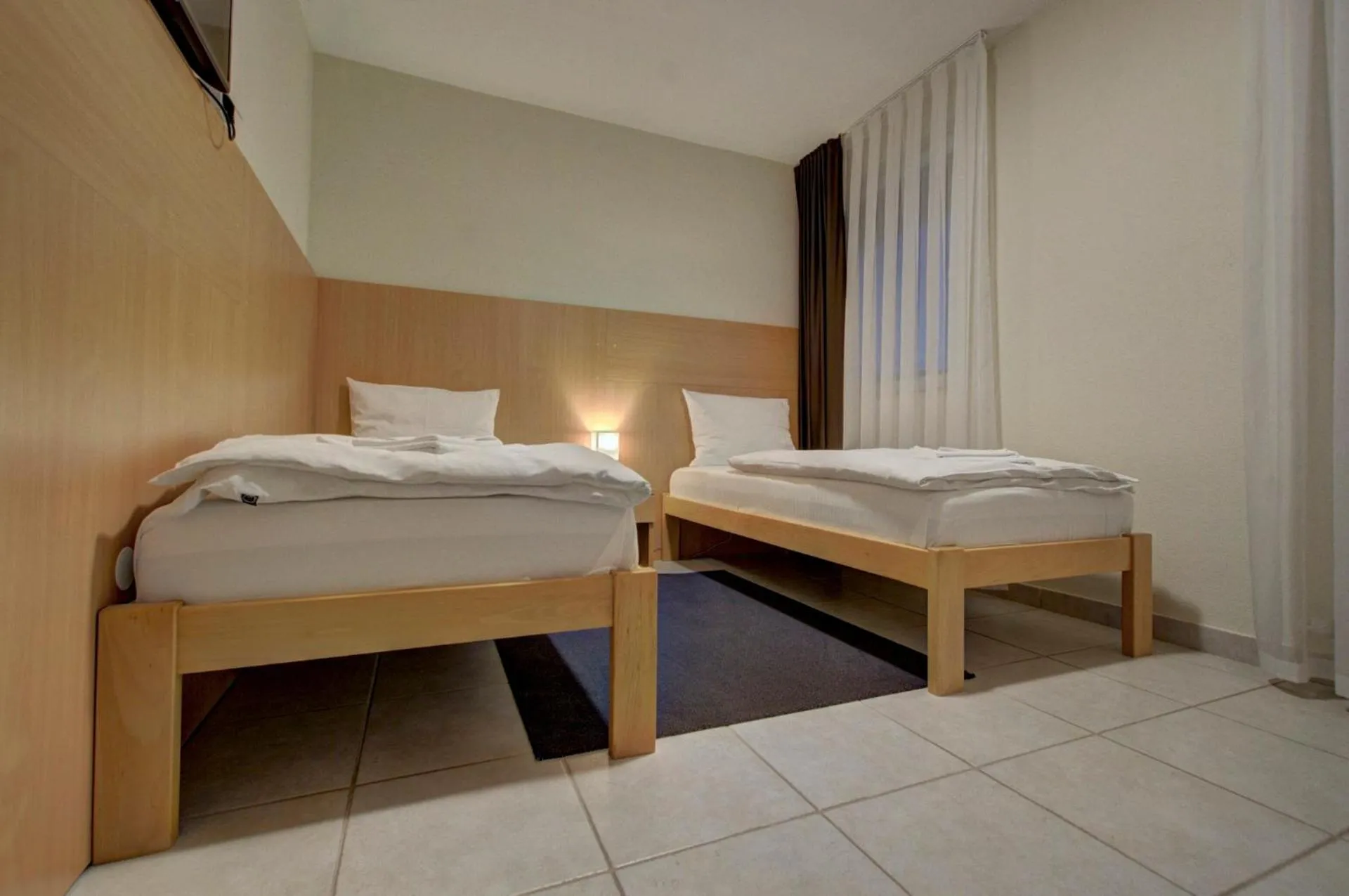 Bed in Tihe Noci Motel