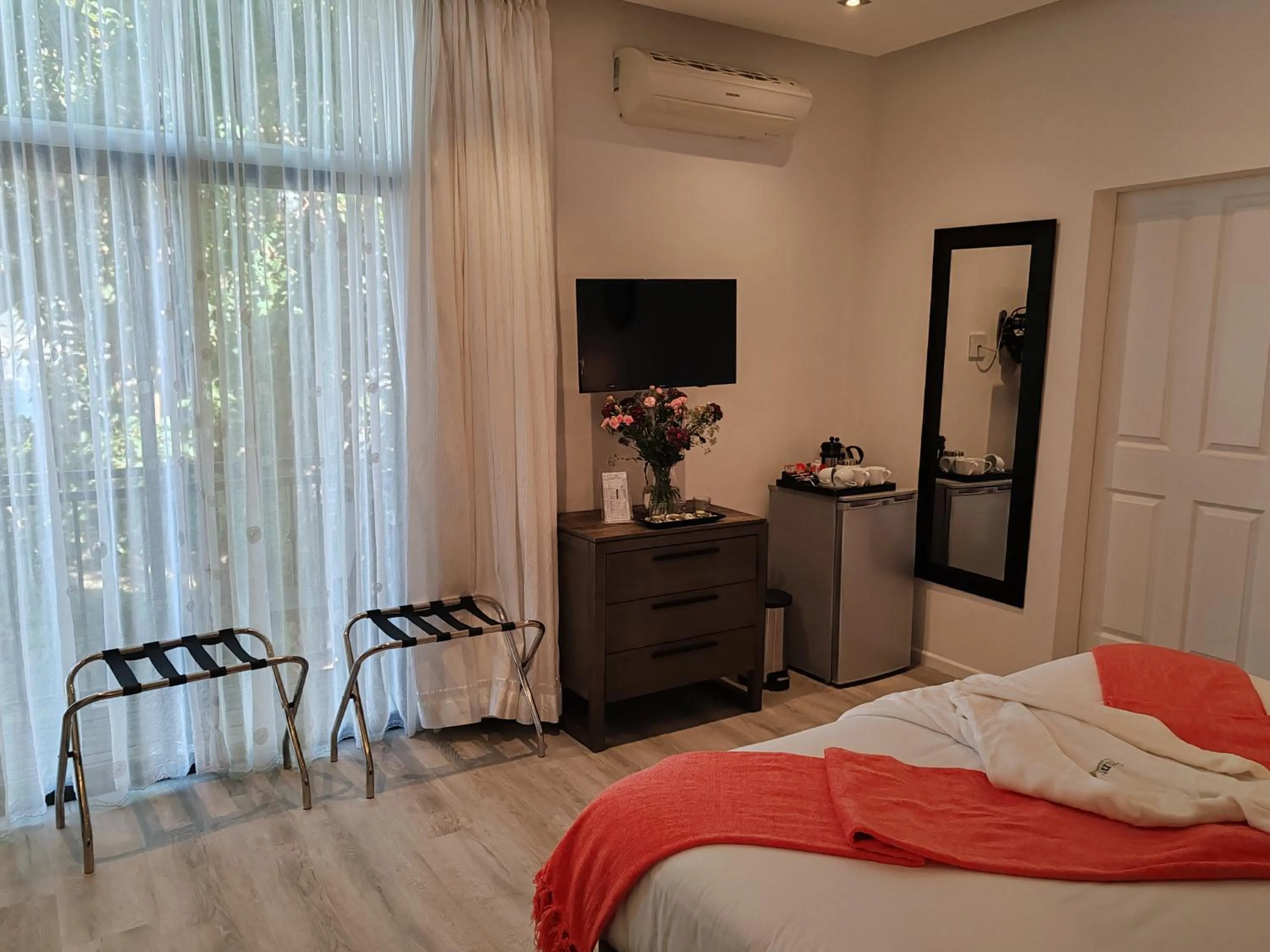 Bed in Point B Guest House -Sustainable Solar Energy