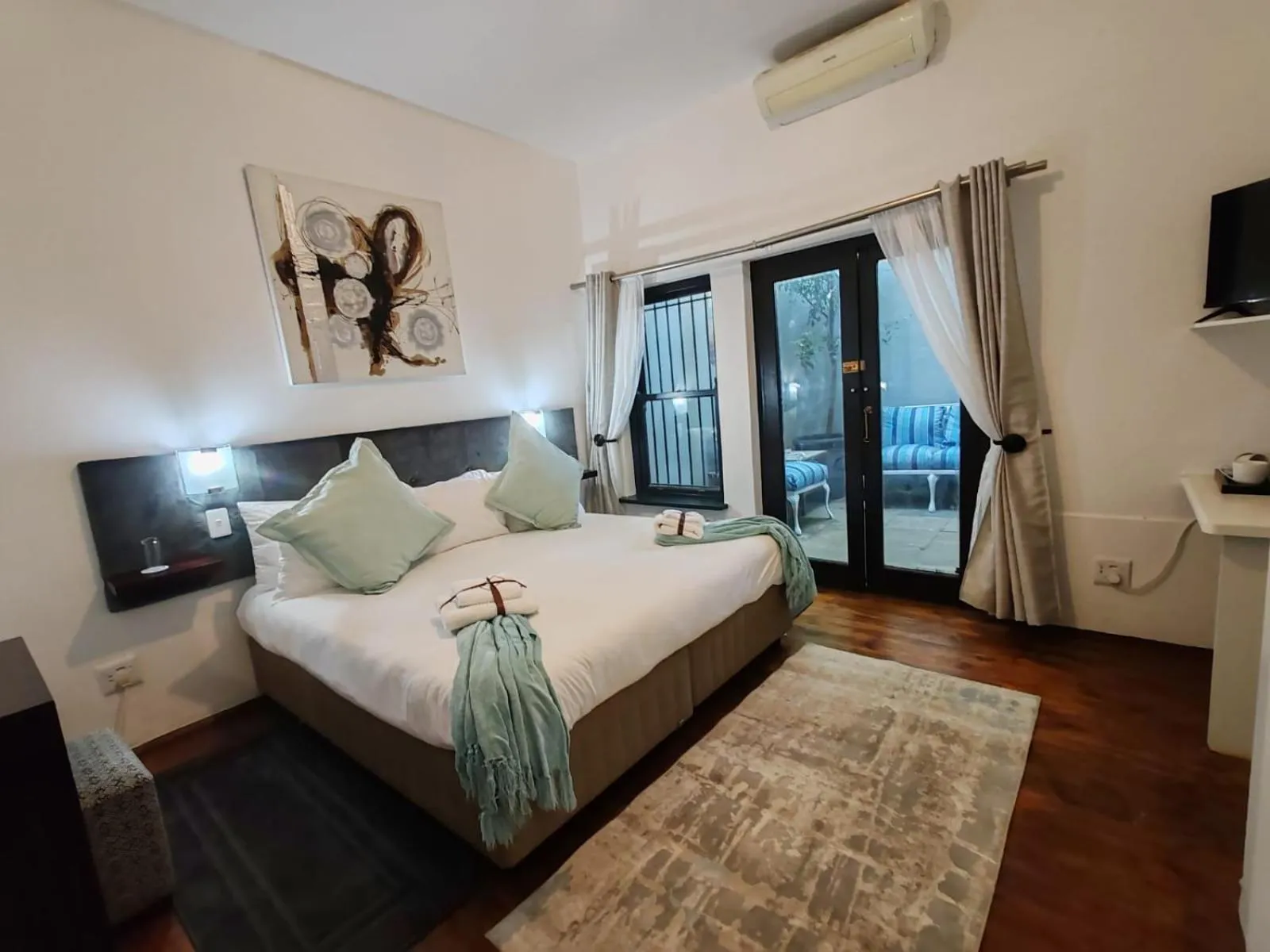 Bed in Point B Guest House -Sustainable Solar Energy