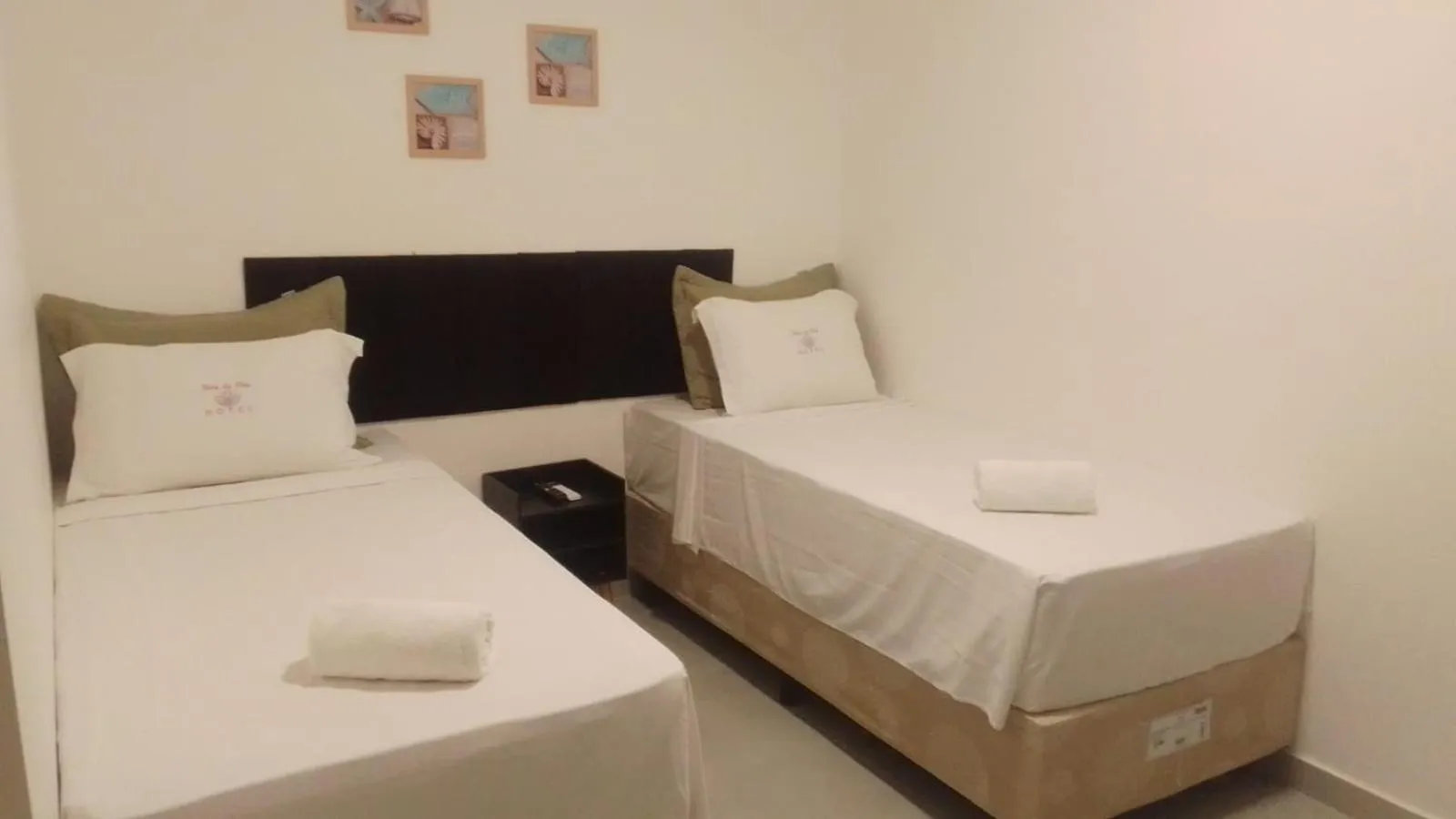 Bed in Hotel Rosa da Ilha Guaruja - 80m do mar, 02 piscinas, sala de jogos, brinquedão de percurso para crianças