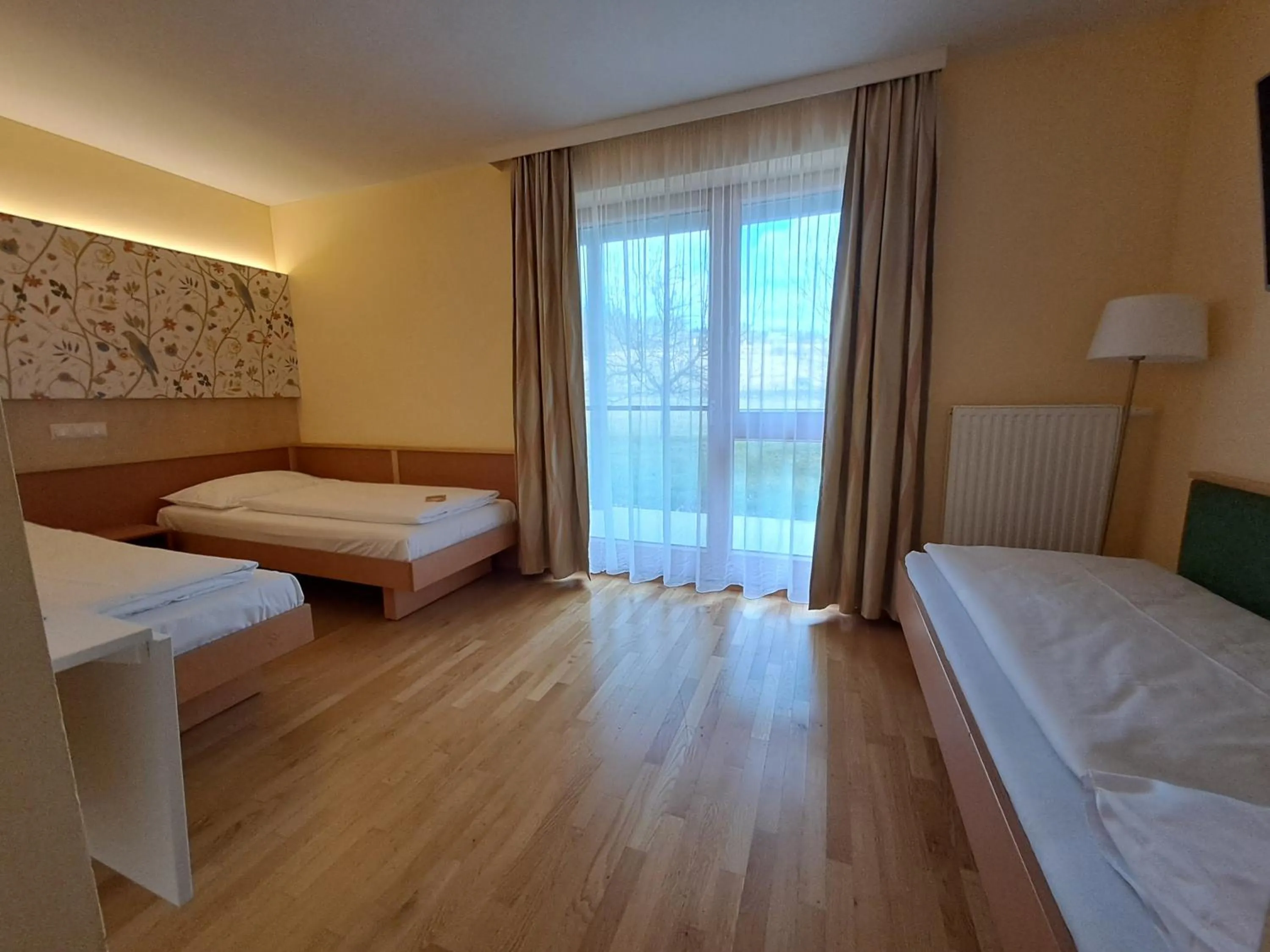 Photo of the whole room, Bed in JUFA Hotel Stubenbergsee