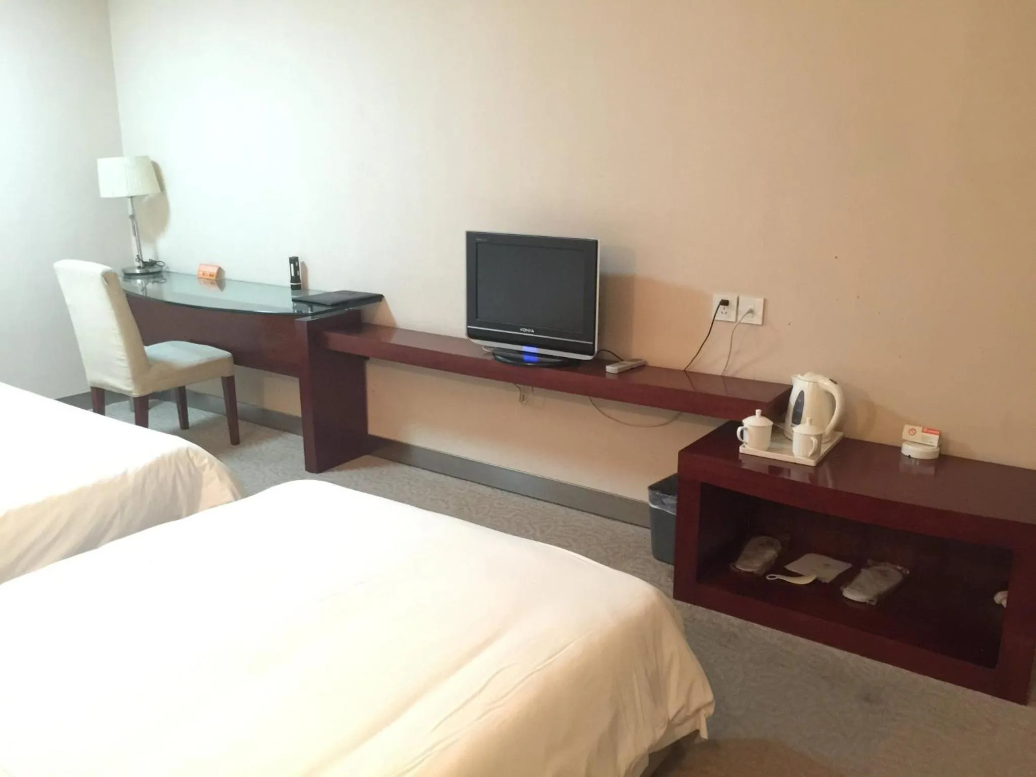 Bed in Ramada Encore by Wyndham Wuhan Int'l Conference Center