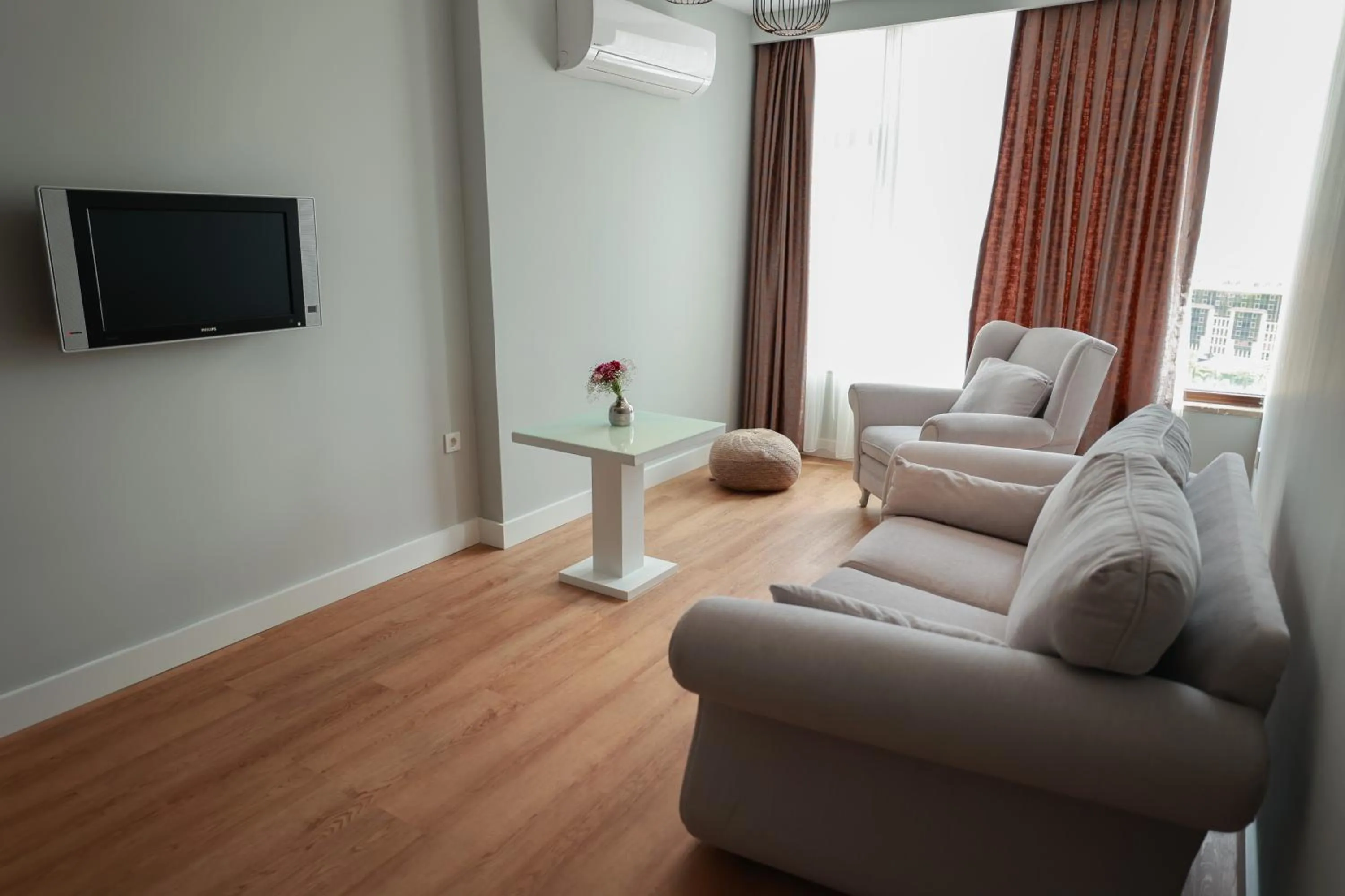 Communal lounge/ TV room in Nova Plaza Orion Hotel