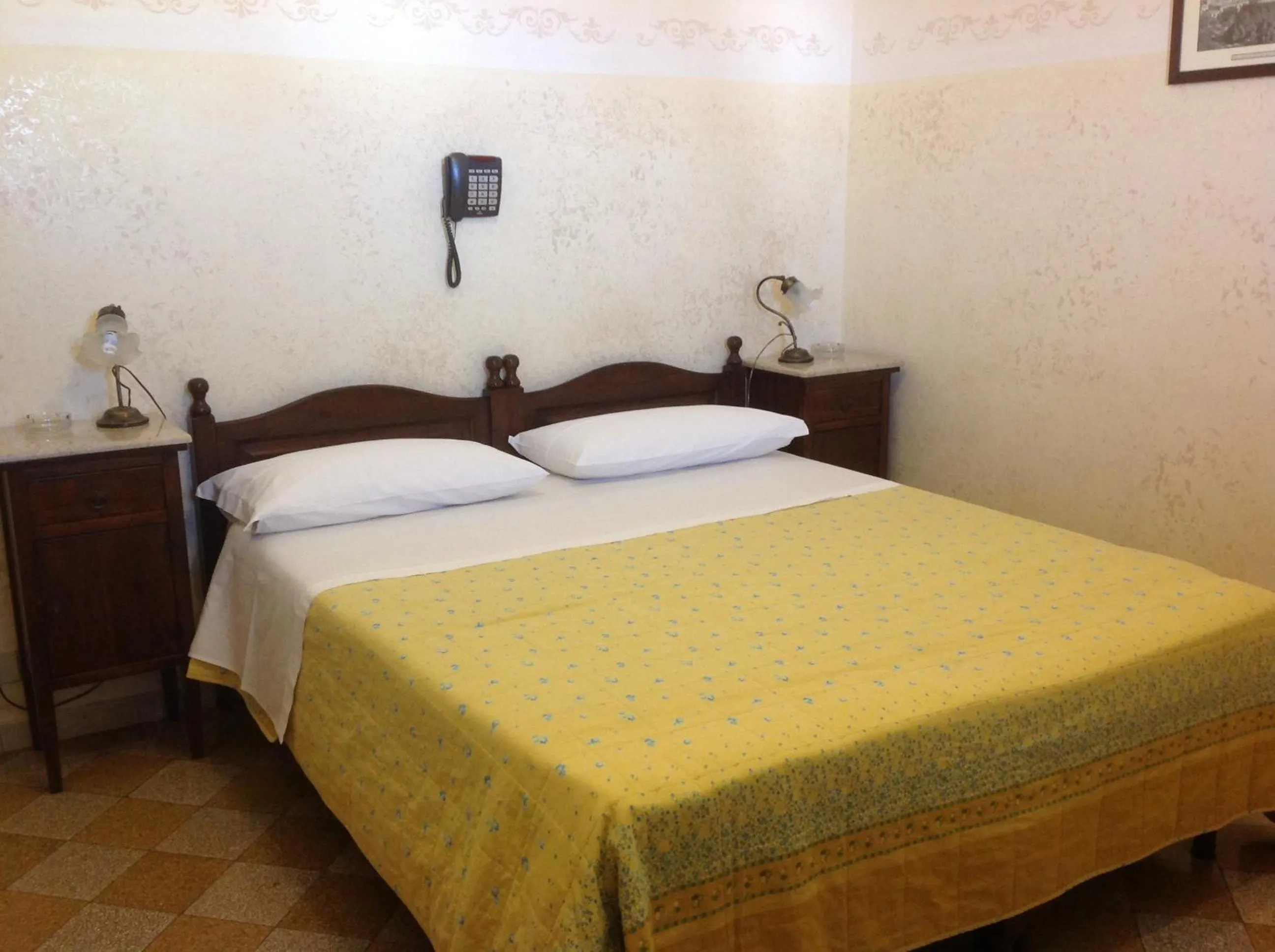Bed in Albergo Cavour