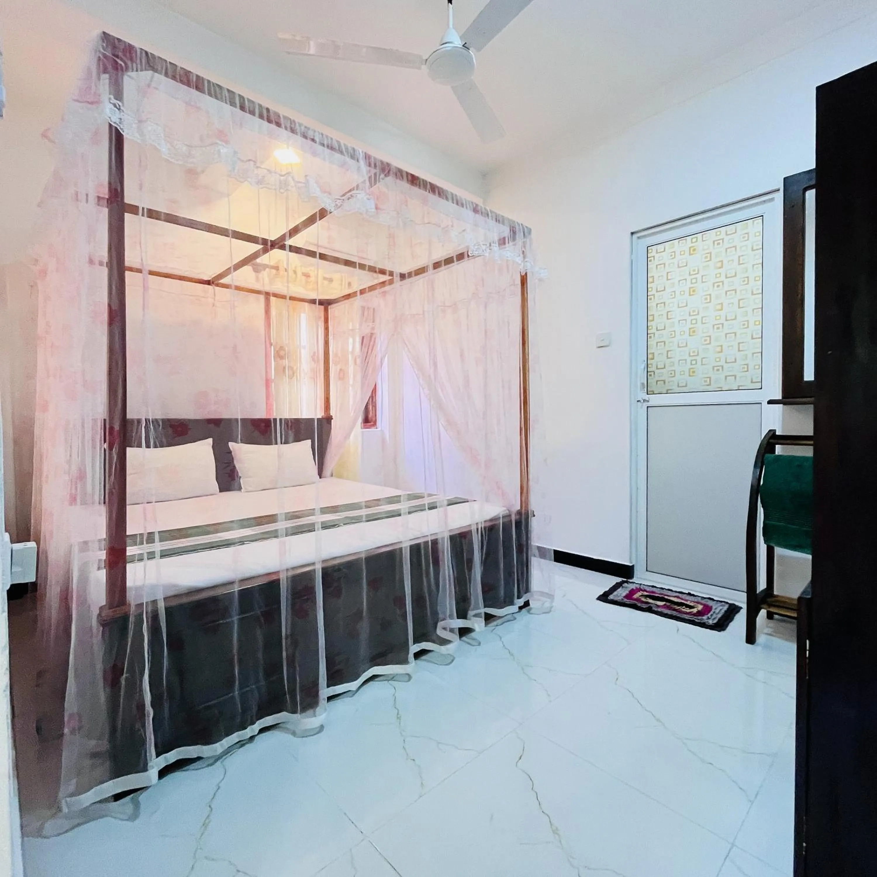 Bed in Wasana Ocean View Villa Mirissa