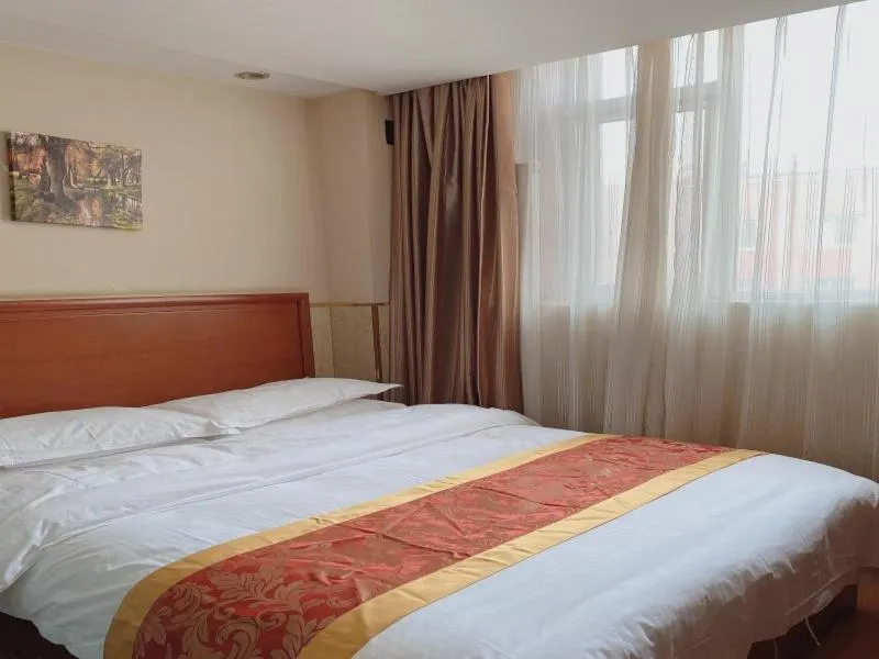 Bed in GreenTree Inn Beijing Shunyi Xinguozhan Express Hotel