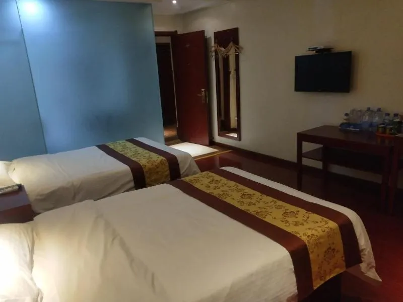 Bed in GreenTree Inn Shandong Heze Development Zone Guangzhou Road Yuehua Express Hotel