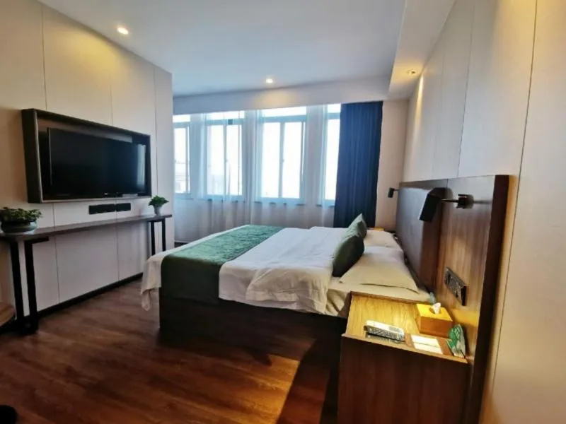 Bed in GreenTree Inn Anhui Lu’an Huoshan Yingjia Avenue Business Hotel