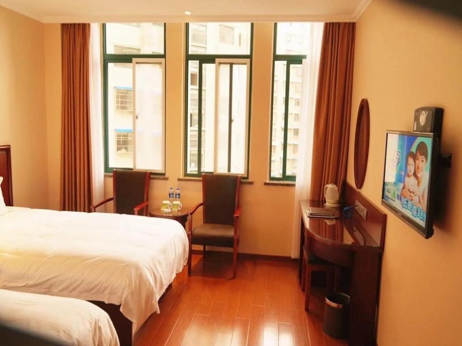 Bed in GreenTree Inn Anhui Lu’an Huoshan Yingjia Avenue Business Hotel