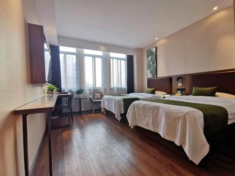 Bed in GreenTree Inn Anhui Lu’an Huoshan Yingjia Avenue Business Hotel