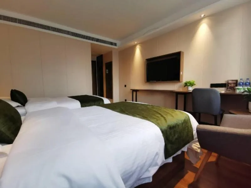 Bed in GreenTree Inn Anhui Lu’an Huoshan Yingjia Avenue Business Hotel