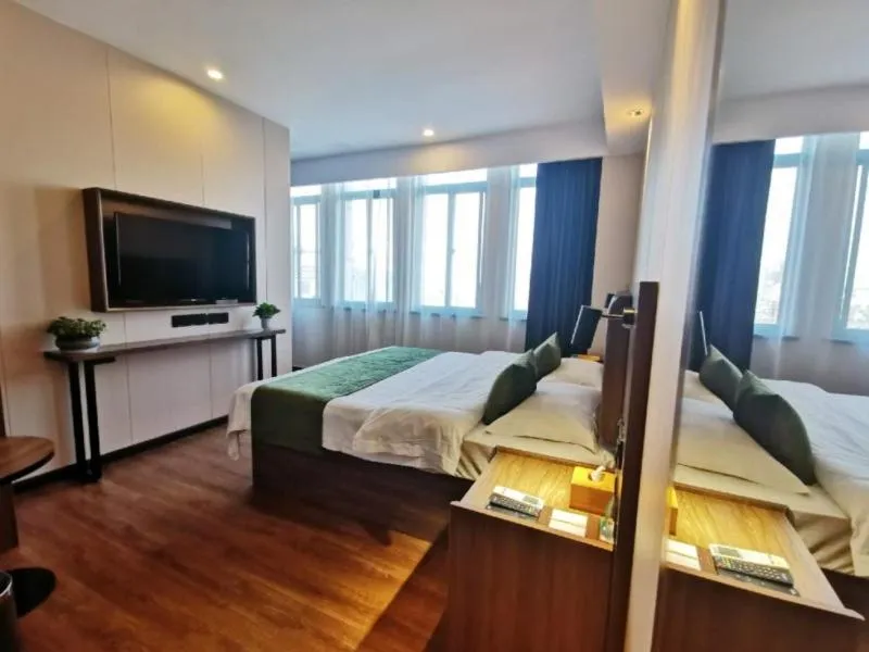 Bed in GreenTree Inn Anhui Lu’an Huoshan Yingjia Avenue Business Hotel