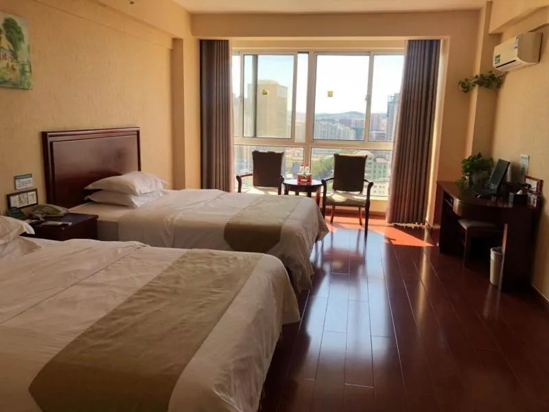 Bed in GreenTree Inn Shandong Weihai Wendeng Darunfa Business Hotel