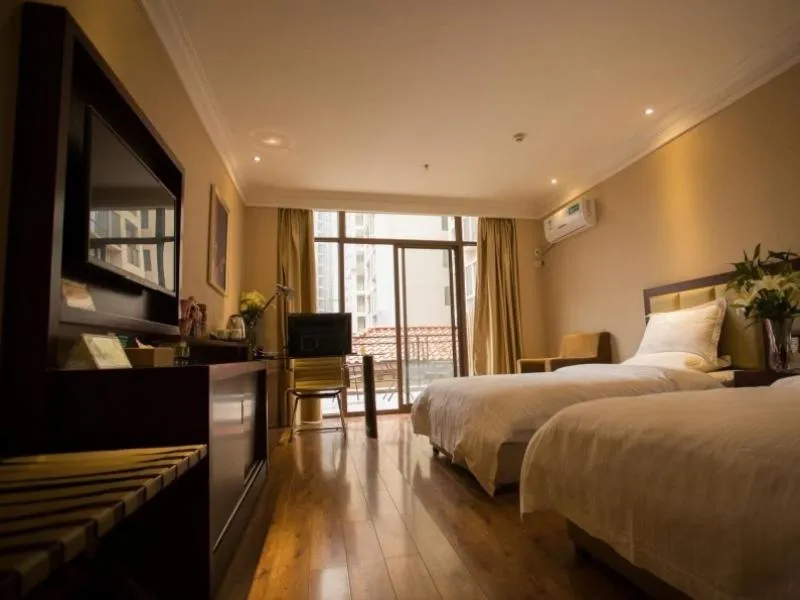 Bed in GreenTree Inn Hubei Huanggang Hong An Wal-Mart Plaza Business Hotel
