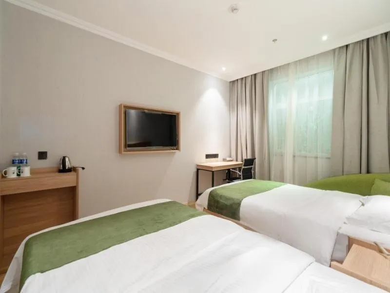Bed in GreenTree Inn Jiangsu Wuxi Taihu Avenue Tongyang Road Express Hotel