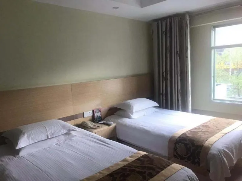 Bed in GreenTree Inn Jiangsu Nantong Haimen Bus Statian Shell Hotel