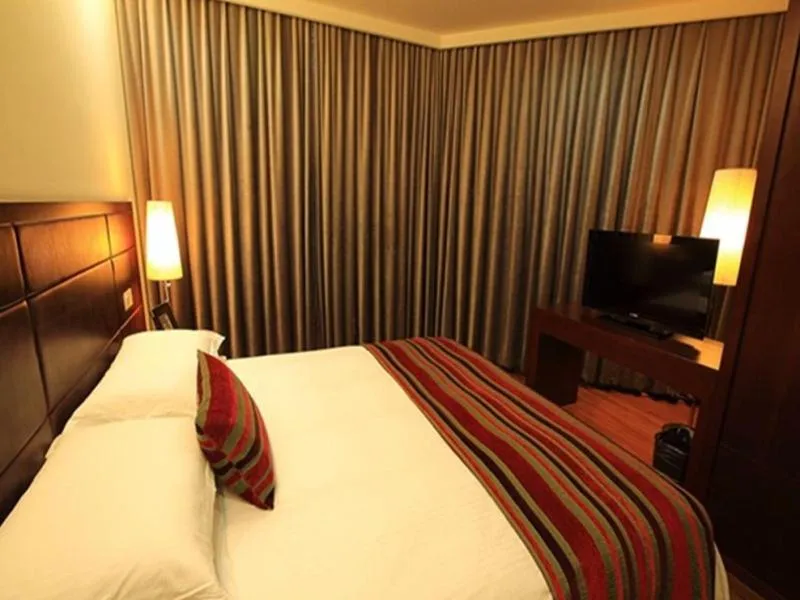Bed in GreenTree Inn Jiangsu Nantong Qidong Middle Heping Road Business Hotel