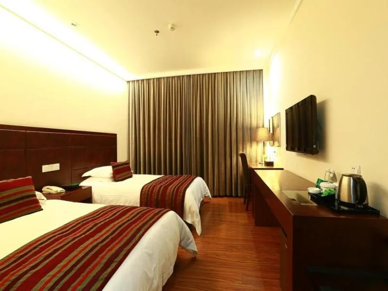 Bed in GreenTree Inn Jiangsu Nantong Qidong Middle Heping Road Business Hotel