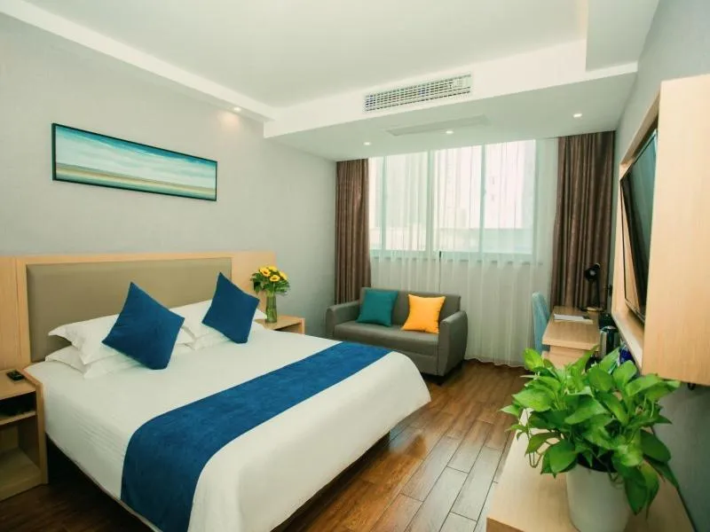 Bed in GreenTree Inn Nantong Hai'an Mingzhu City Express Hotel