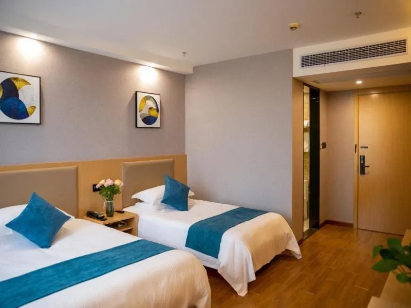 Bed in GreenTree Inn Nantong Hai'an Mingzhu City Express Hotel