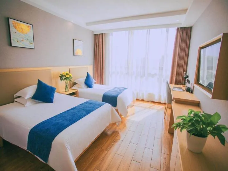 Bed in GreenTree Inn Nantong Hai'an Mingzhu City Express Hotel