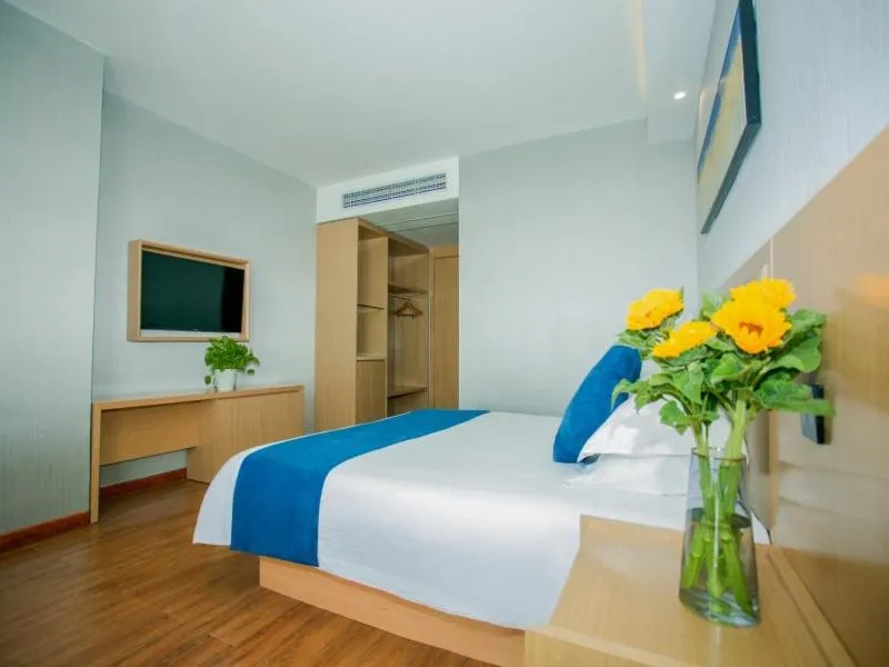 Bed in GreenTree Inn Nantong Hai'an Mingzhu City Express Hotel