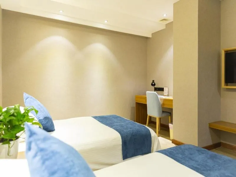 Bed in GreenTree Inn Nantong Hai'an Mingzhu City Express Hotel