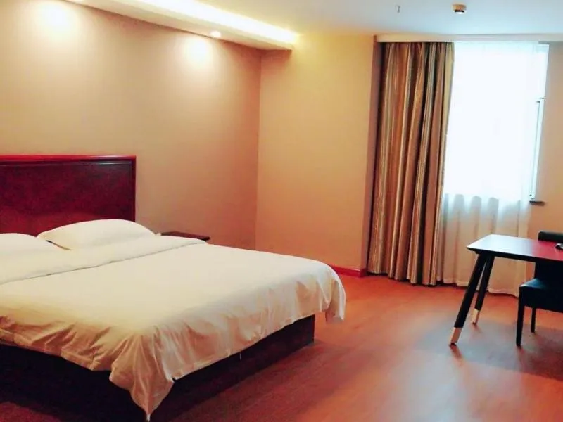 Bed in GreenTree Inn Jiangsu Nantong Rugao Ninghai Road Express Hotel