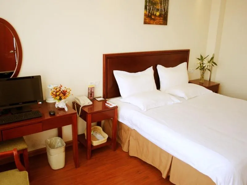 Bed in GreenTree Inn Jiangsu Taizhou Xinghua Anfeng Runan Garden Express Hotel
