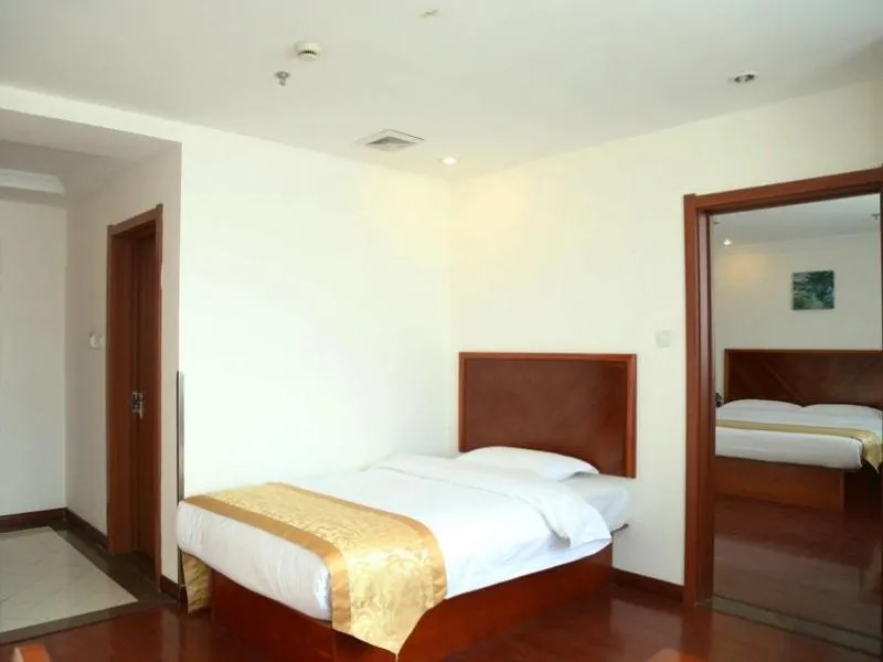 Bed in GreenTree Inn Jiangsu Taizhou Taidong Railway Station Business Hotel