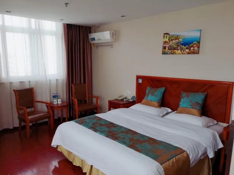 Bed in GreenTree Inn Jiangsu Taizhou Taidong Railway Station Business Hotel