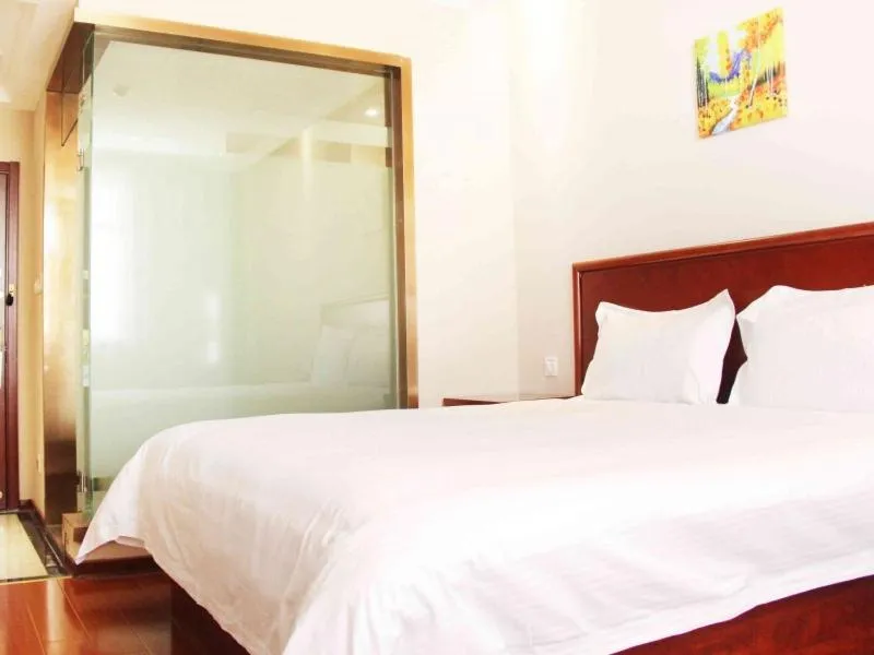 Bed in GreenTree Inn Shandong Qingdao Development District SDUST Express Hotel