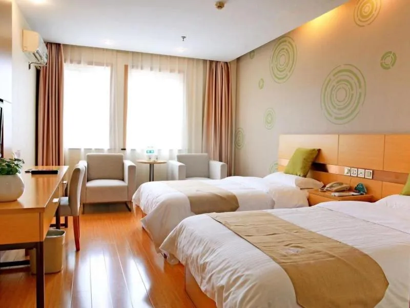 Bed in GreenTree Inn Zhejiang Shaoxing Xinchang Buddha Express Hotel