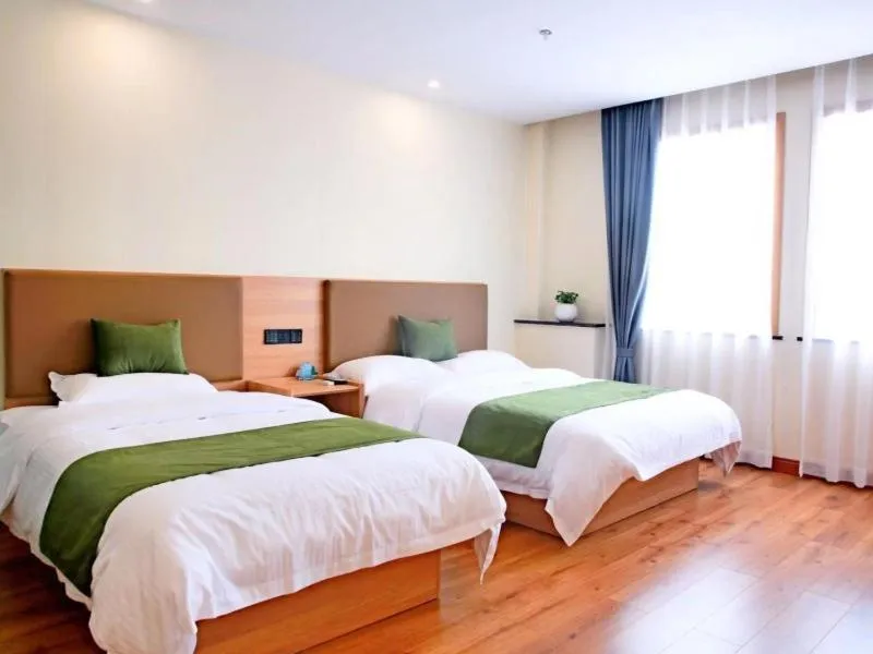 Bed in GreenTree Inn Zhejiang Shaoxing Xinchang Buddha Express Hotel