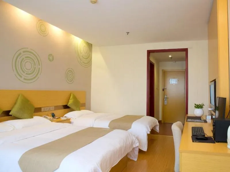 Bed in GreenTree Inn Zhejiang Shaoxing Xinchang Buddha Express Hotel