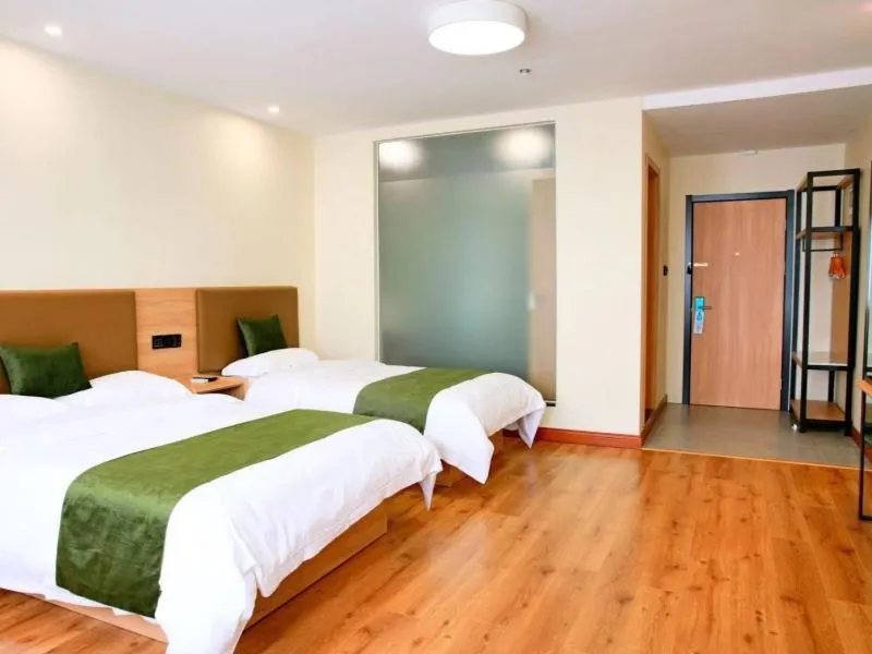 Bed in GreenTree Inn Zhejiang Shaoxing Xinchang Buddha Express Hotel