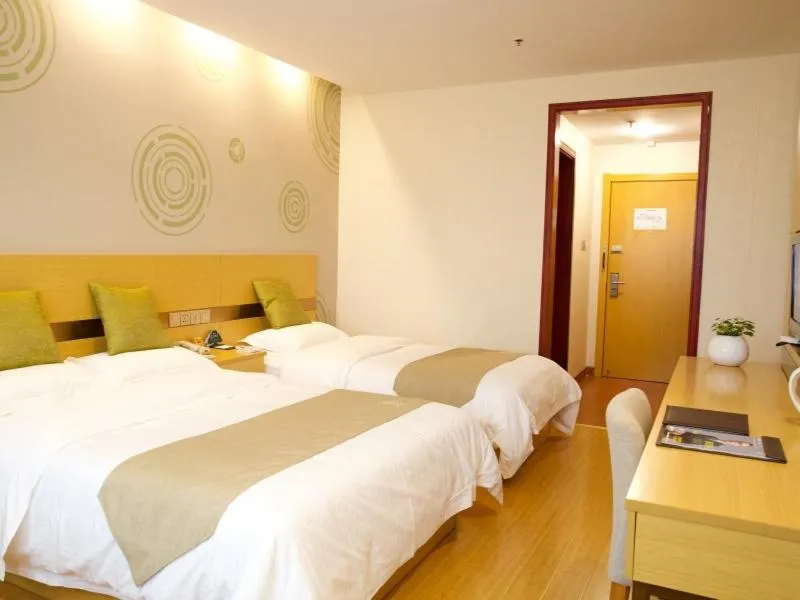 Bed in GreenTree Inn Zhejiang Shaoxing Xinchang Buddha Express Hotel