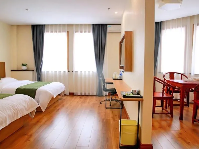 Bed in GreenTree Inn Zhejiang Shaoxing Xinchang Buddha Express Hotel