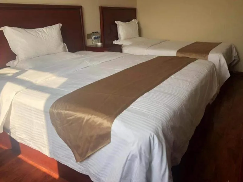 Bed in GreenTree Inn Shanxi Xinzhou South Jianshe Road Express Hotel