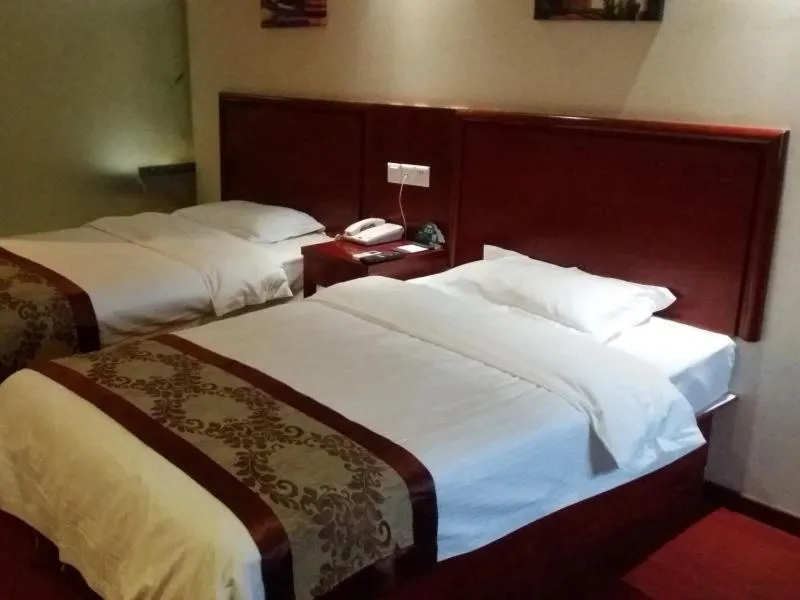 Bed in GreenTree Inn Anhui Bozhou Mengcheng Zhuangzi Road Express Hotel