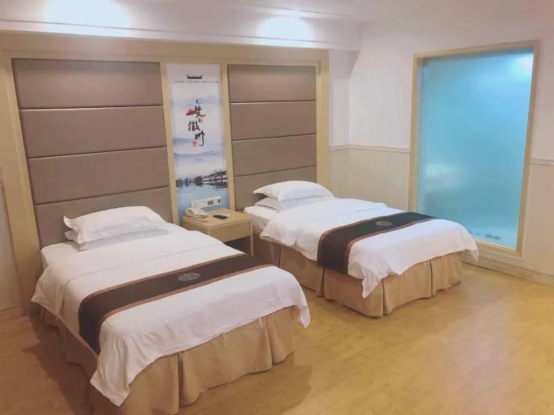 Bed in GreenTree Inn AnHui HuangShan She County HuiZhou Ancient City Middle HuangShan Road Business Hotel