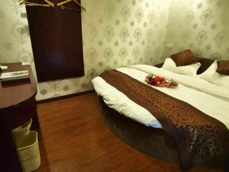 Bed in GreenTree Inn JiangSu WuXi BaShi HuaXiaQingCheng XiGang Road Shell Hotel