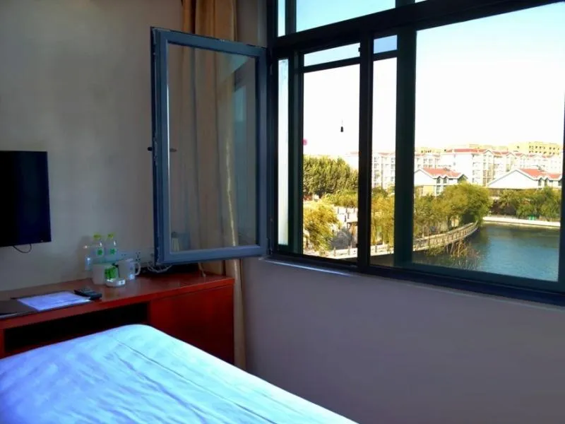 Bed in GreenTree Inn Shandong Qingdao Jiaozhou Bus Terminal Station Hai'er Avenue Express Hotel