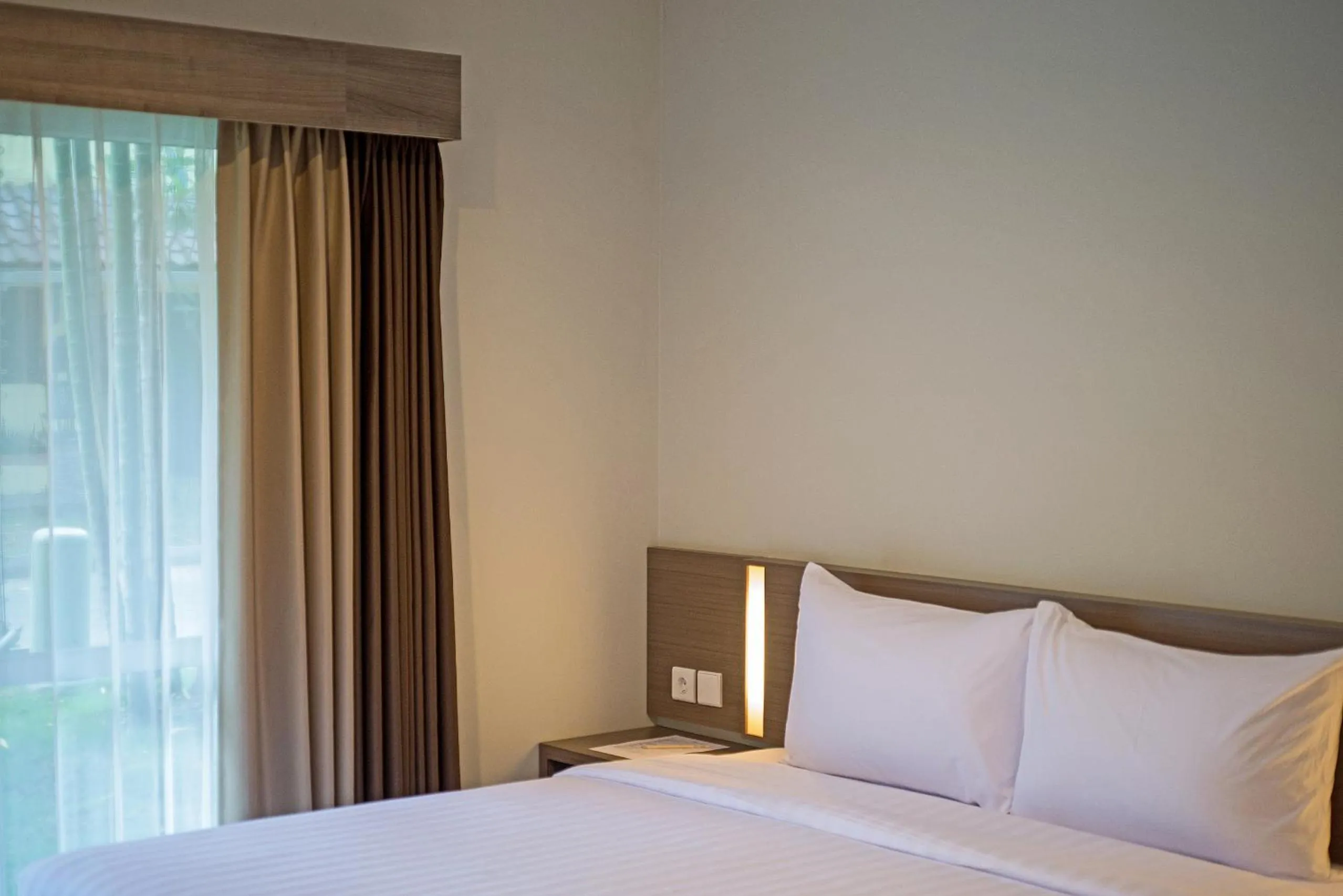 Bed in Whiz Prime Hotel Darmo Harapan Surabaya