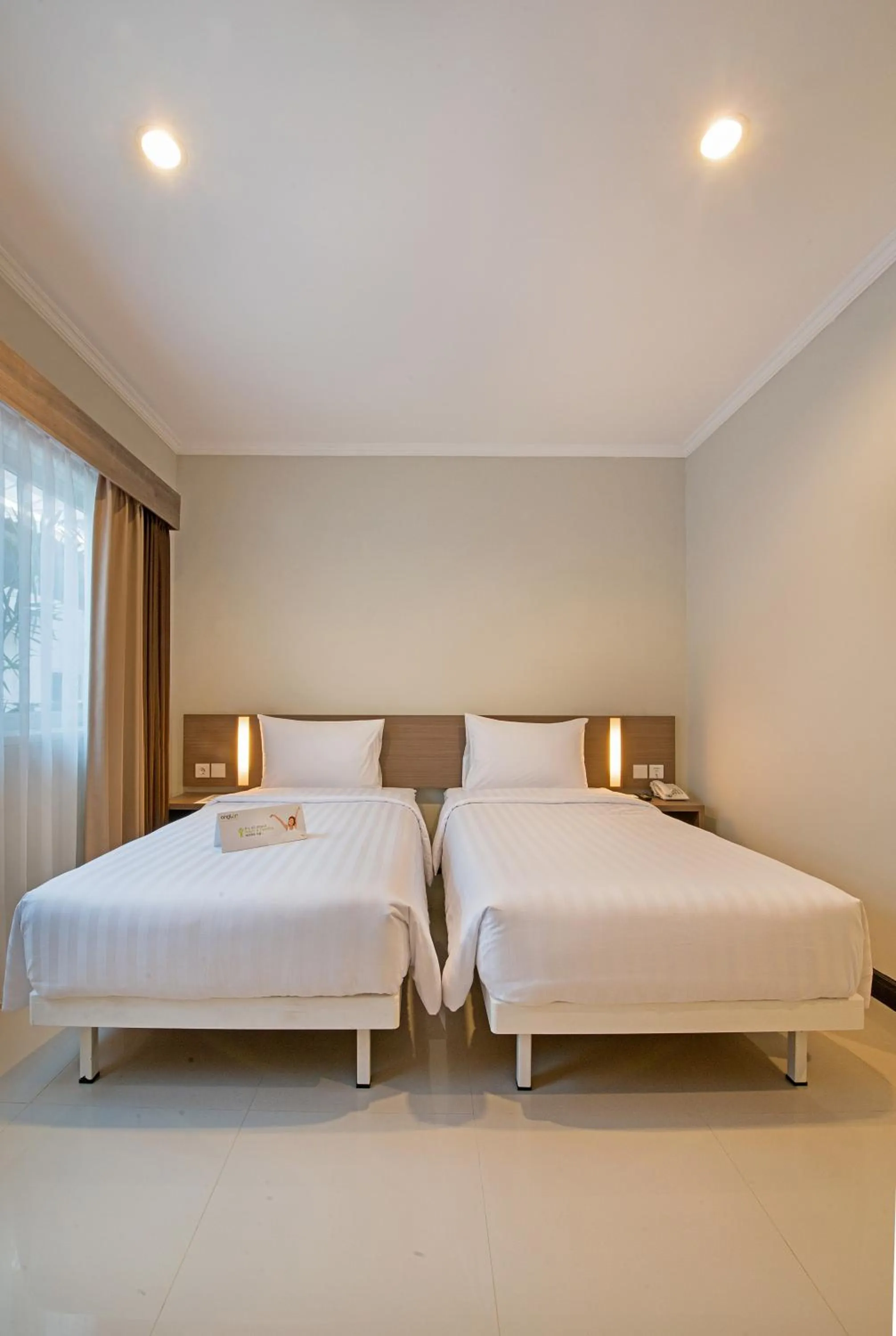 Bed in Whiz Prime Hotel Darmo Harapan Surabaya