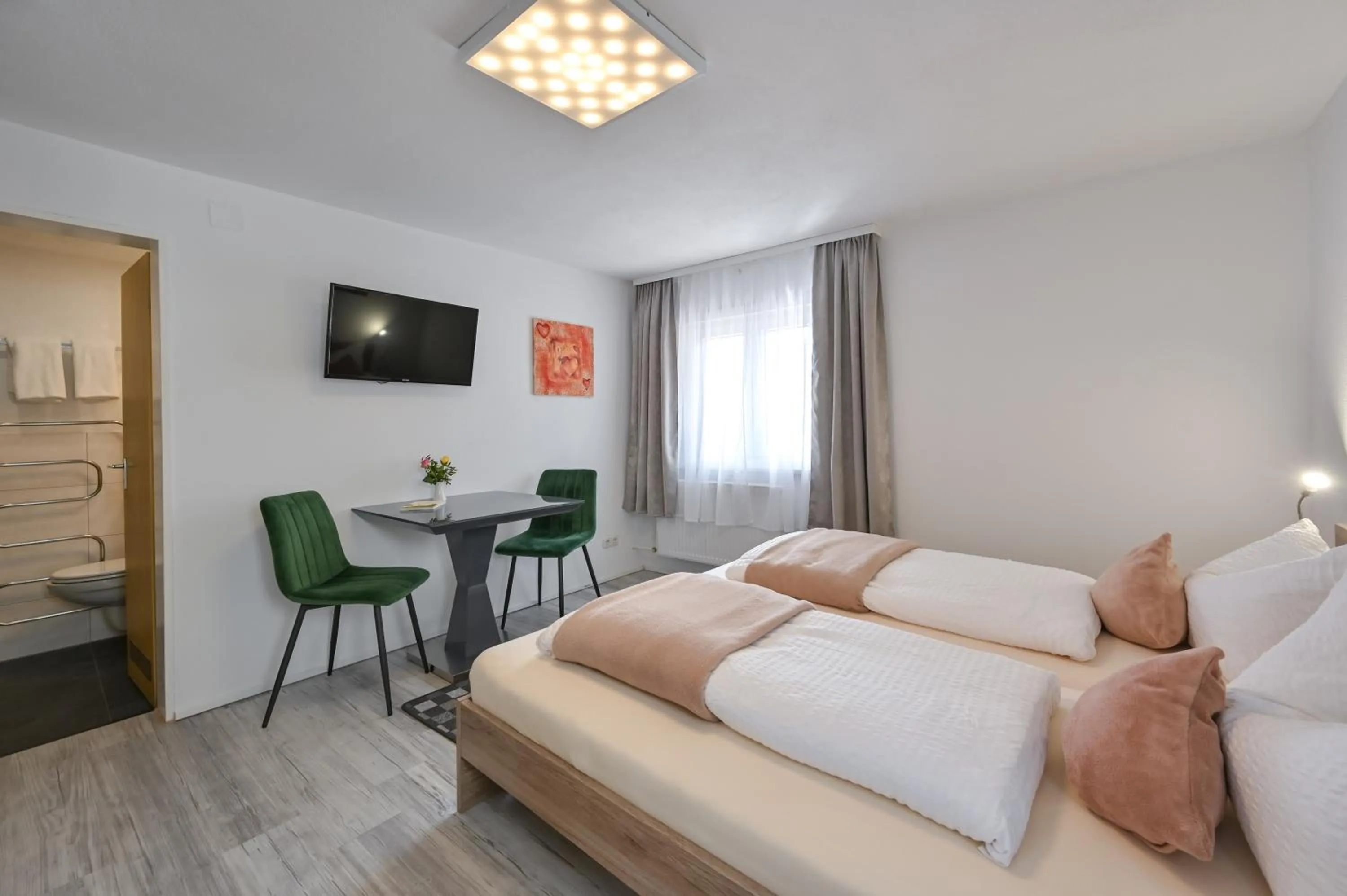 Seating area, Bed in Pension Freiheit