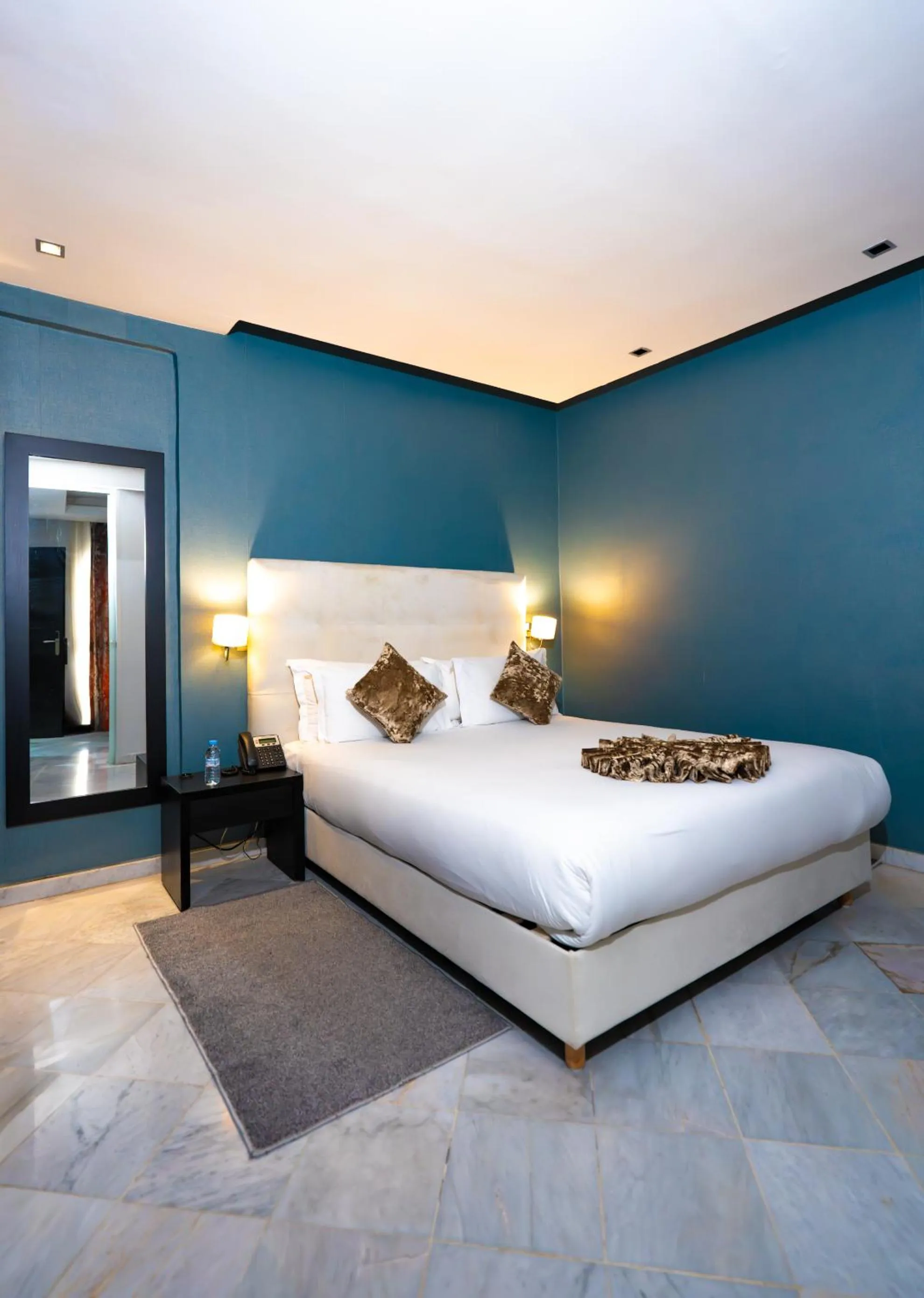 Bed in The Fourteen Luxury Boutique Hotel