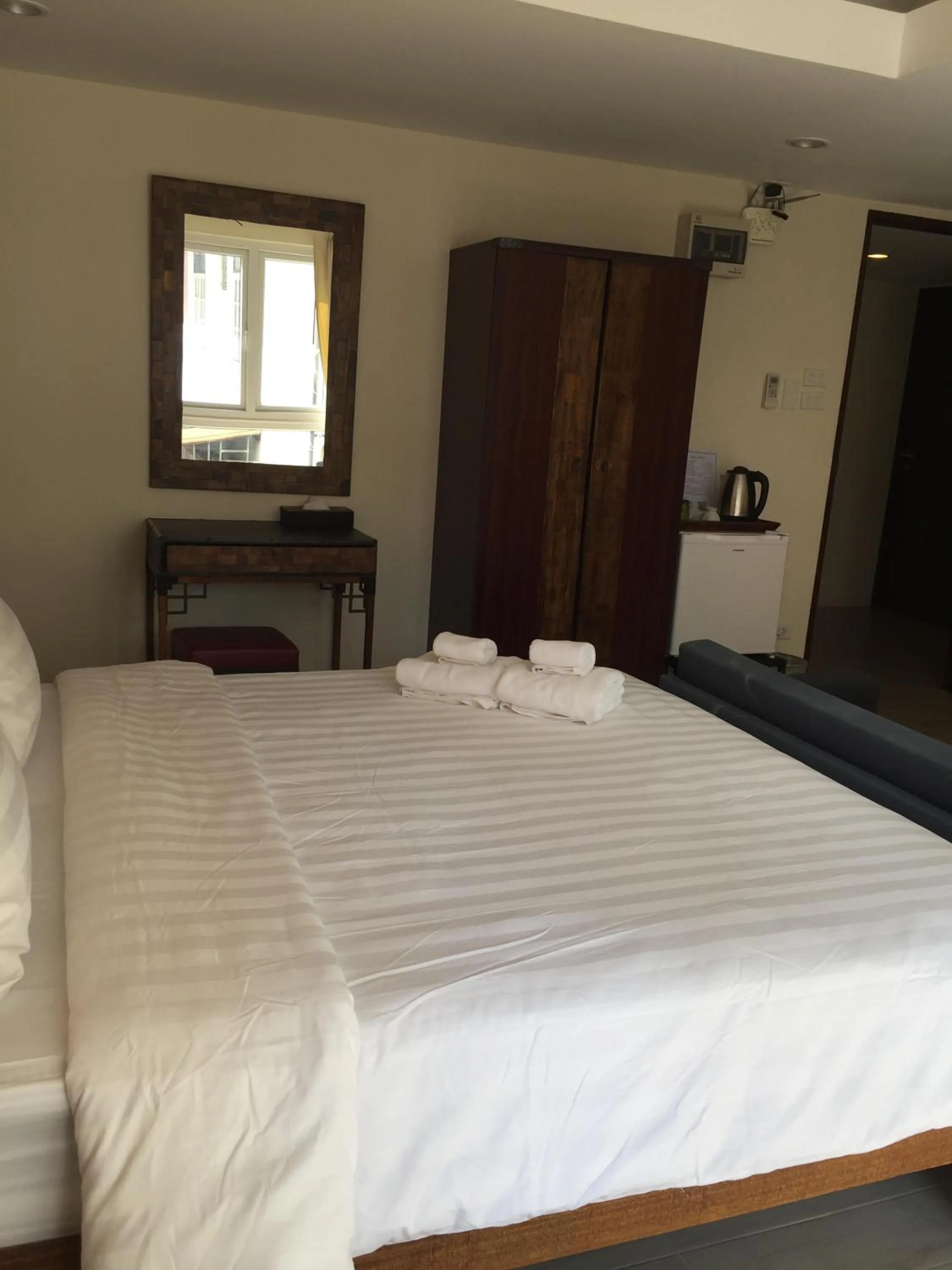 Bed in Arcadia Maephim Serviced Apartments